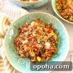Quick Summer Dinner Recipes for Lazy Weeknights 11 Blackstone fried rice in a green bowl ready to serve.