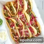 Quick Summer Dinner Recipes for Lazy Weeknights 13 Serving dish full of pork tacos.