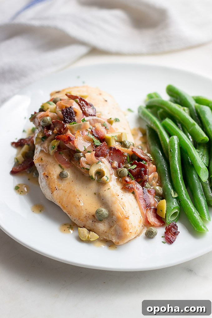 Chicken tapenade with a piquant sauce of bacon, caper, lemon, olives, and butter, shows low carb eating at it's best.