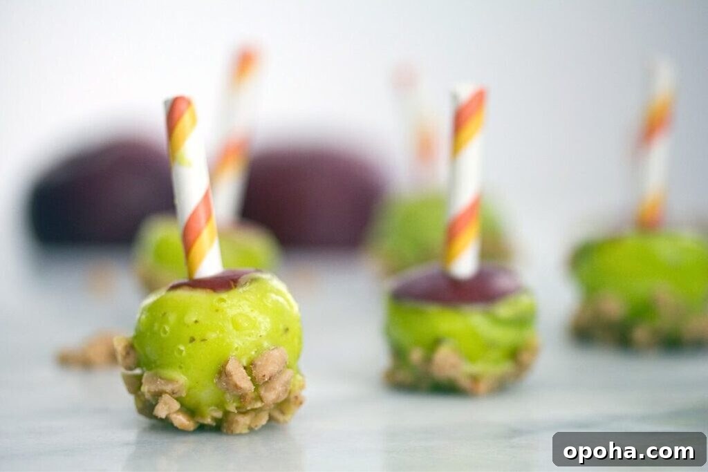 18 Spooky Halloween Movie Night Snacks to Delight Your Guests 19 Apple bites dipped in candy, then caramel for bite sized apples.