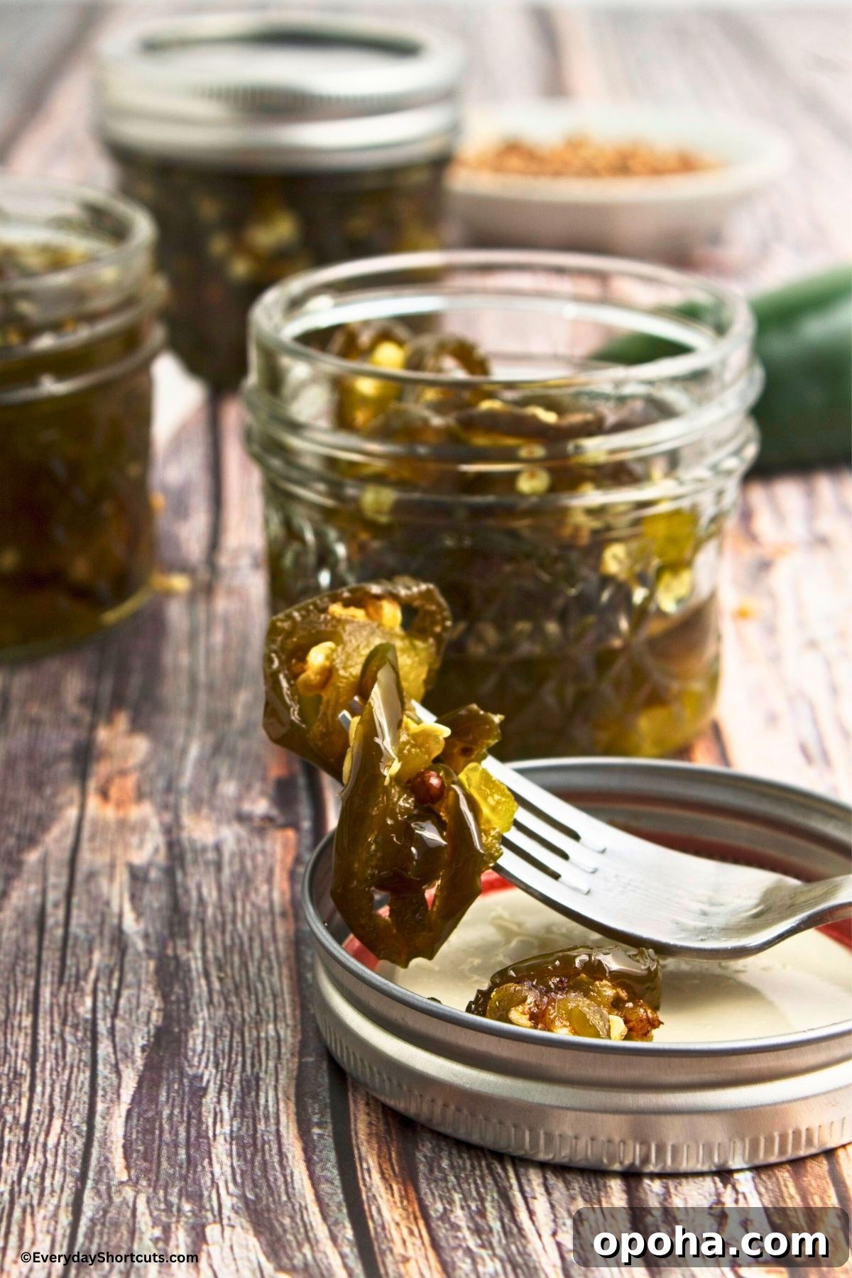 Candied Jalapeños (Cowboy Candy) Recipe for Sweet-Spicy Pickled Peppers 2 sliced jalapenos candied on a fork