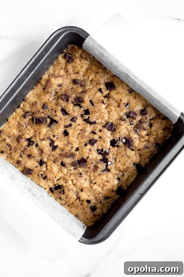 Tahini Blondies (Paleo, Gluten-Free Tahini Brownies) 8 uncooked paleo tahini blondies in an 8x8 inch pan