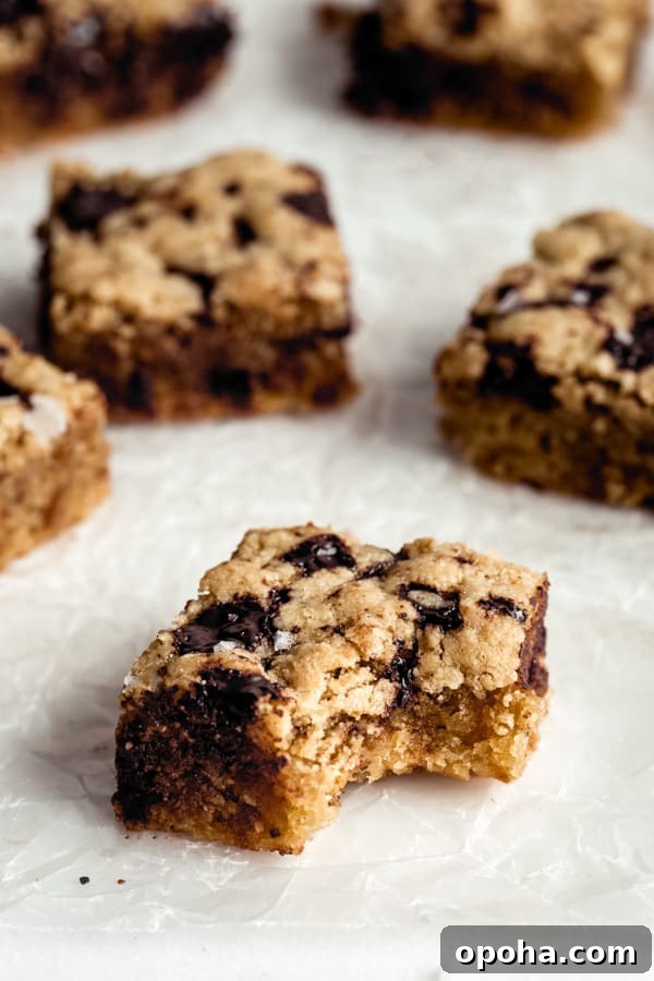 Tahini Blondies (Paleo, Gluten-Free Tahini Brownies) 10 a paleo tahini blondie with a bite taken out of it