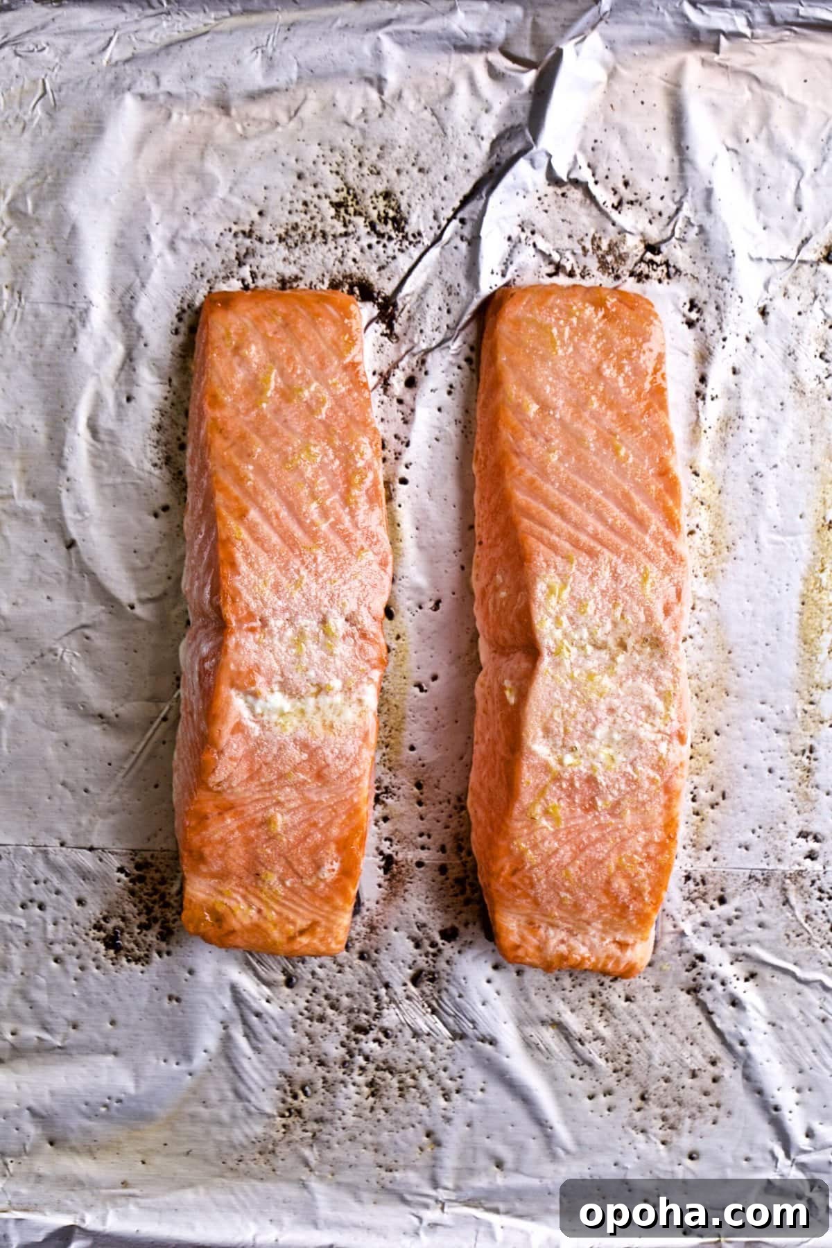 Oven-Baked Salmon with Fresh Basil Pesto 6 baked salmon on prepared baking sheet after it is cooked.