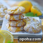 Zesty Lemon Crinkle Cookies Recipe for Bright, Chewy Cookies 8 Lemon Cookie stack with a bite.