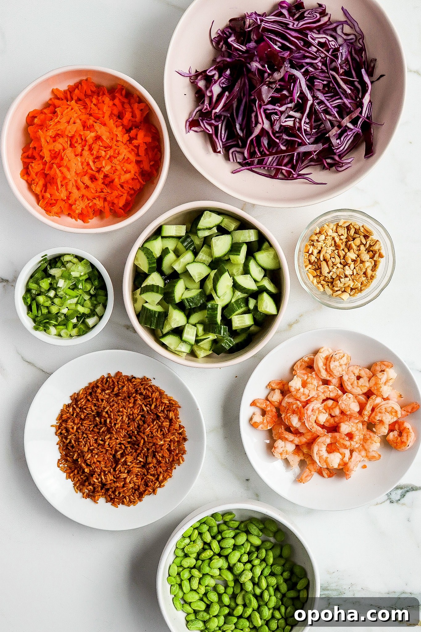 Top down view of fresh vegetable ingredients in big and small bowls for crispy rice salad