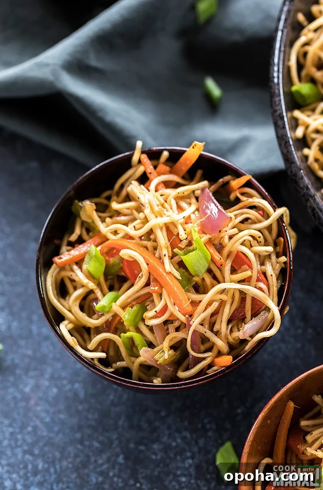 vegetarian hakka noodles in a small wooden bowl