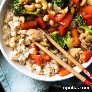 Paleo & keto cashew chicken with cauliflower rice and chopsticks