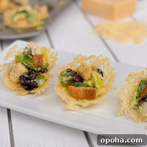 Mini Parmesan Caesar Salad Cups: Crispy Baked Appetizer 12 parmesan salad cups on a plate