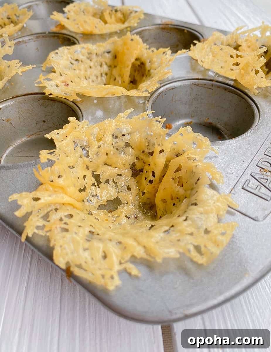 Mini Parmesan Caesar Salad Cups: Crispy Baked Appetizer 5 shredded Parmesan cheese baked in muffin cups