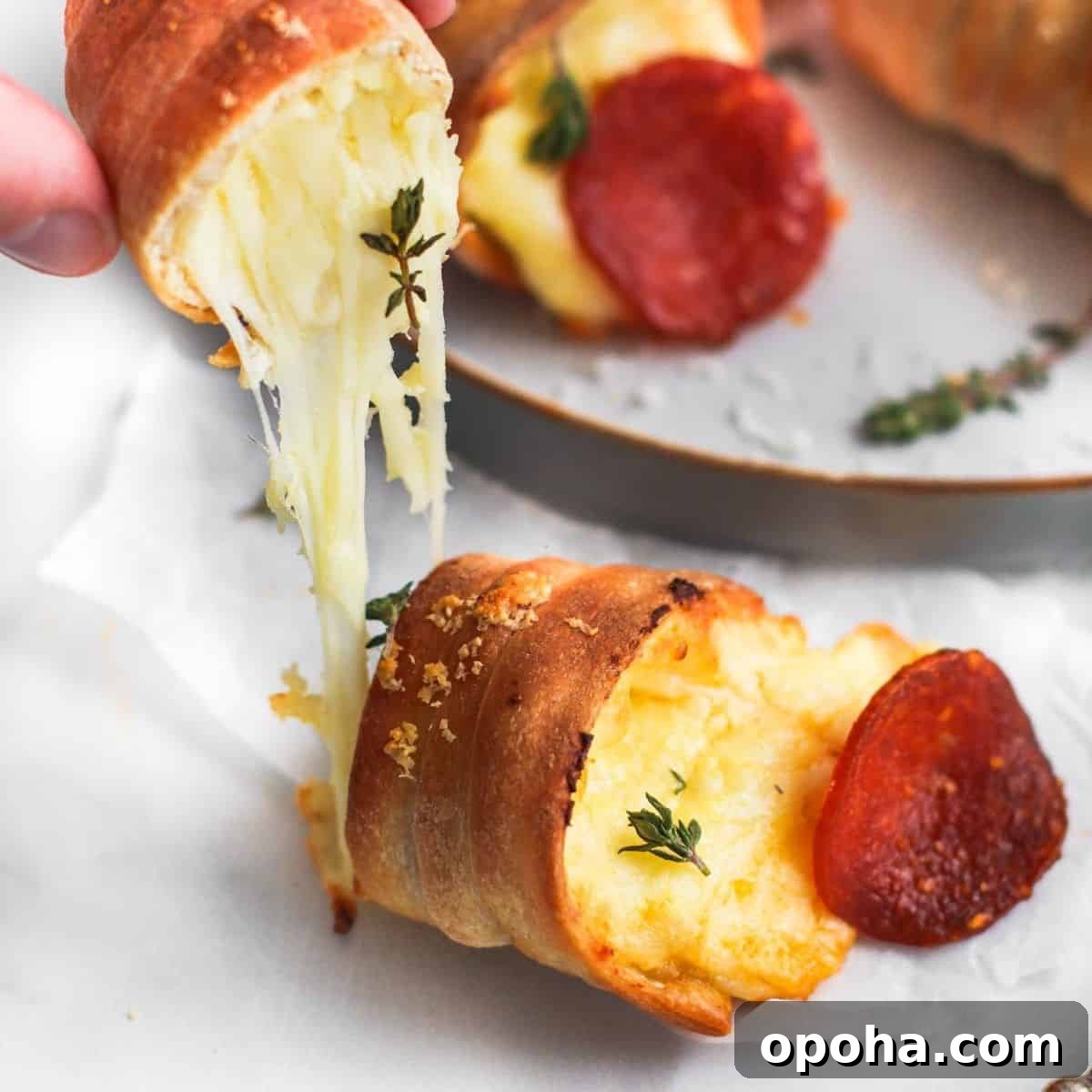 Mini Parmesan Caesar Salad Cups: Crispy Baked Appetizer 9 Pizza cone on table with cheese oozing out.