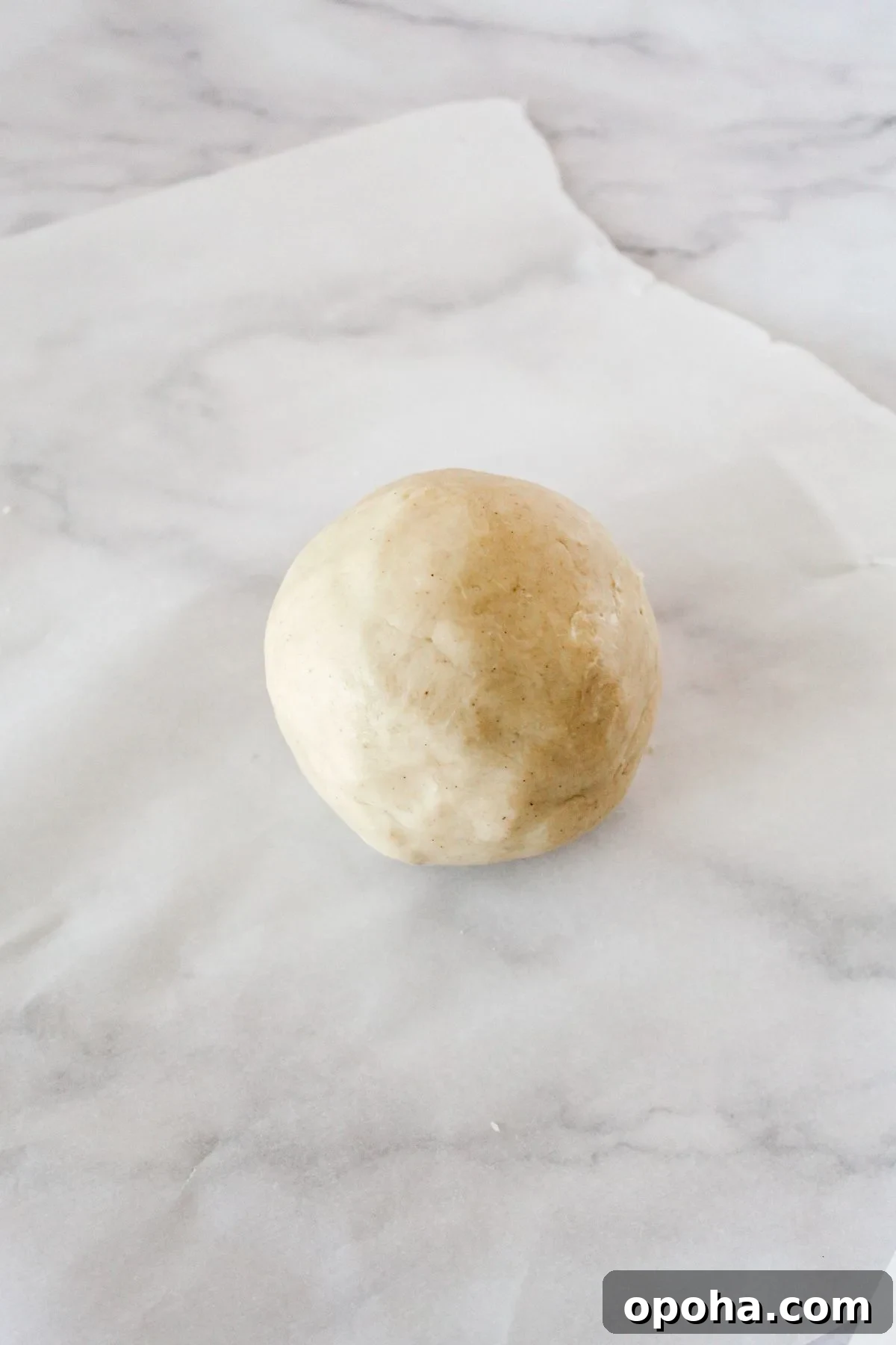 Flaky Gluten-Free Pie Crust Recipe (Dairy-Free) 6 Gluten free pie crust dough in a ball on parchment paper.