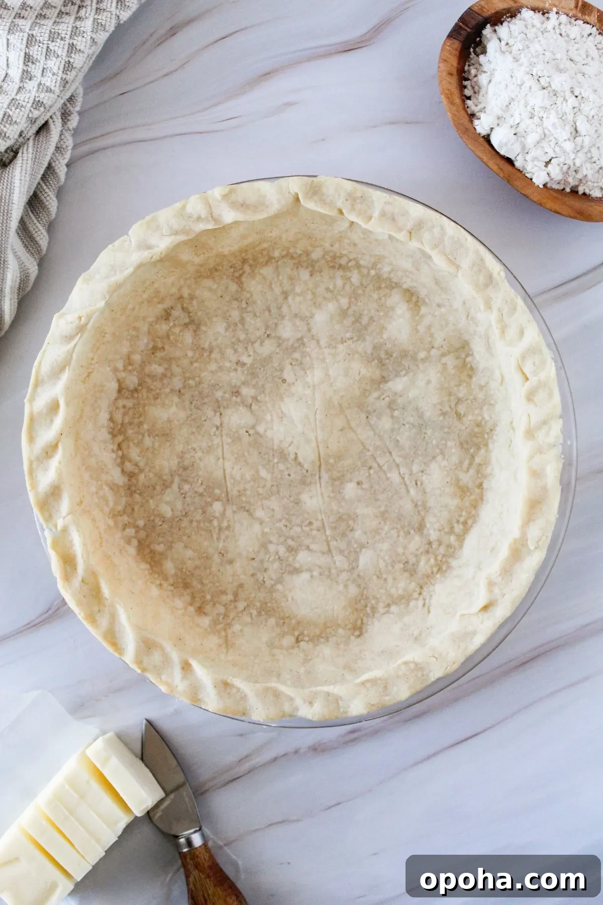 Flaky Gluten-Free Pie Crust Recipe (Dairy-Free) 11 Looking down on a oie crust in a pie plate.