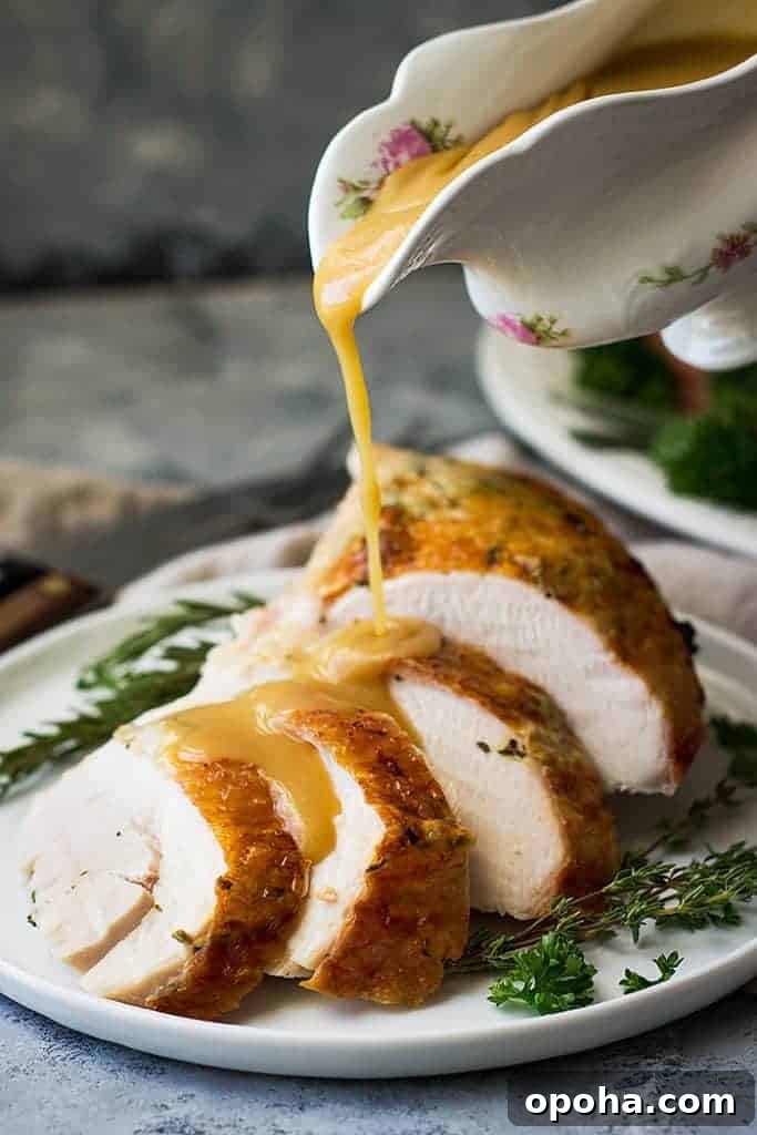 Herb-Roasted Spatchcock Turkey Recipe for Juicy, Crispy Skin 3 pouring gravy over spatchcock turkey recipe