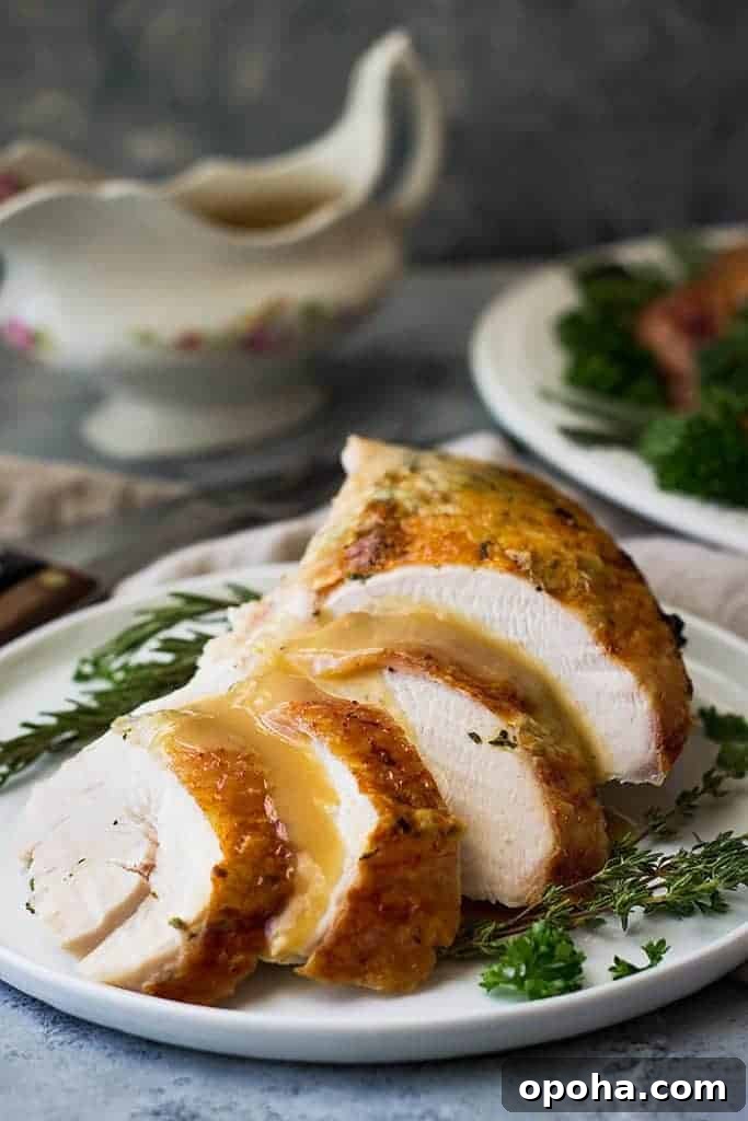 Herb-Roasted Spatchcock Turkey Recipe for Juicy, Crispy Skin 4 closeup: roasted spatchcocked turkey on a white serving dish