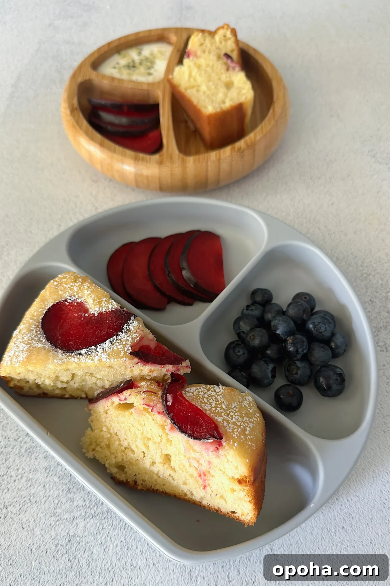 Moist Yogurt Plum Cake Recipe for Perfect Summer Baking 6 Yogurt plum cake served with fruits.