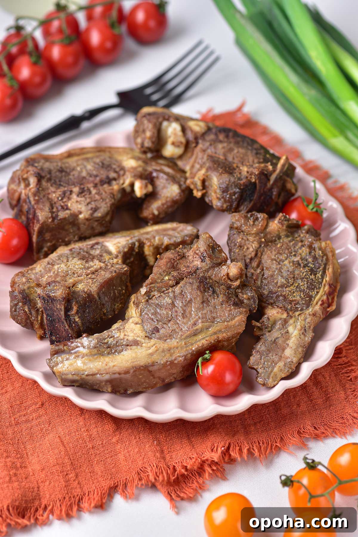 A plate of cooked lamb chops ready to serve