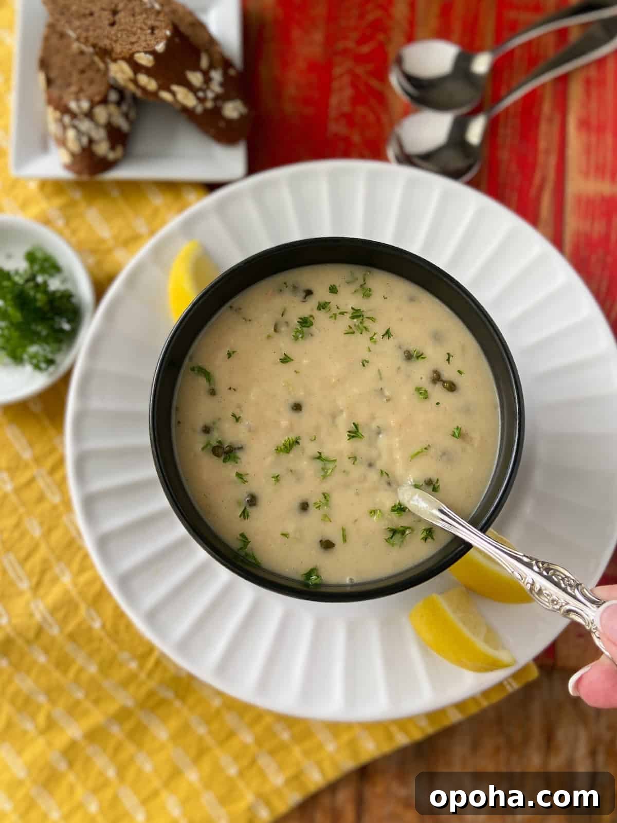 Velvety White Bean Soup with Garlic and Herbs 2 White bean soup in black bowl.