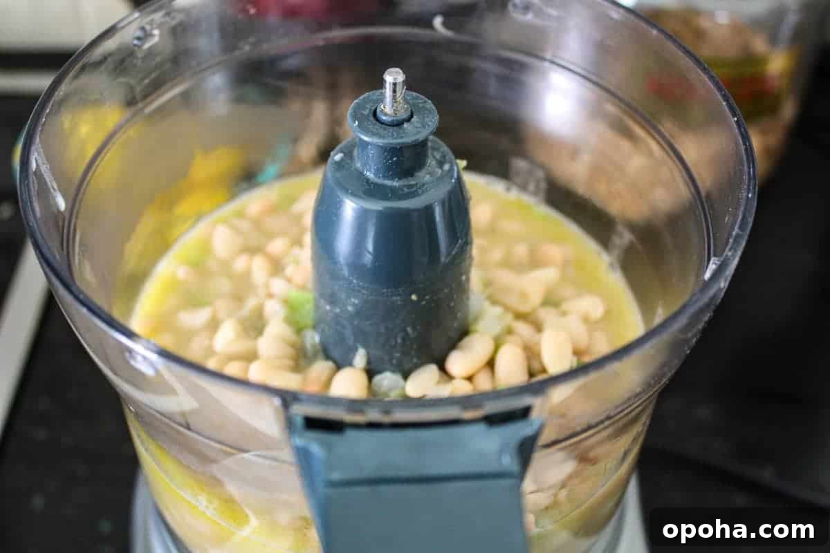 Velvety White Bean Soup with Garlic and Herbs 6 Bean mixture in food processor.