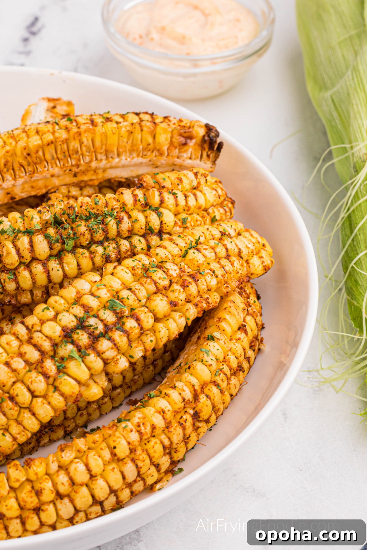 Crispy Air Fryer Corn Ribs Recipe 2 Air fryer corn ribs on a plate, ready to eat.