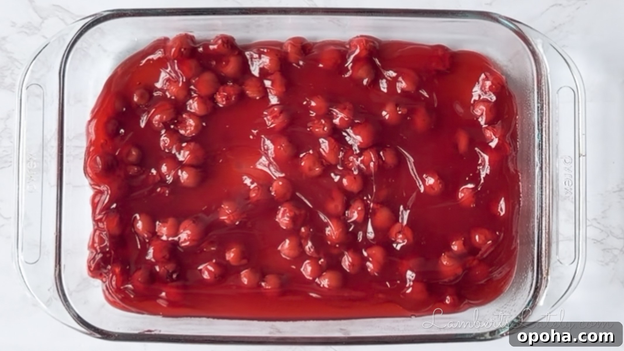 Decadent Chocolate Cherry Dump Cake Recipe for Chocolate Lovers 6 cherry pie filling in a pyrex baking dish.