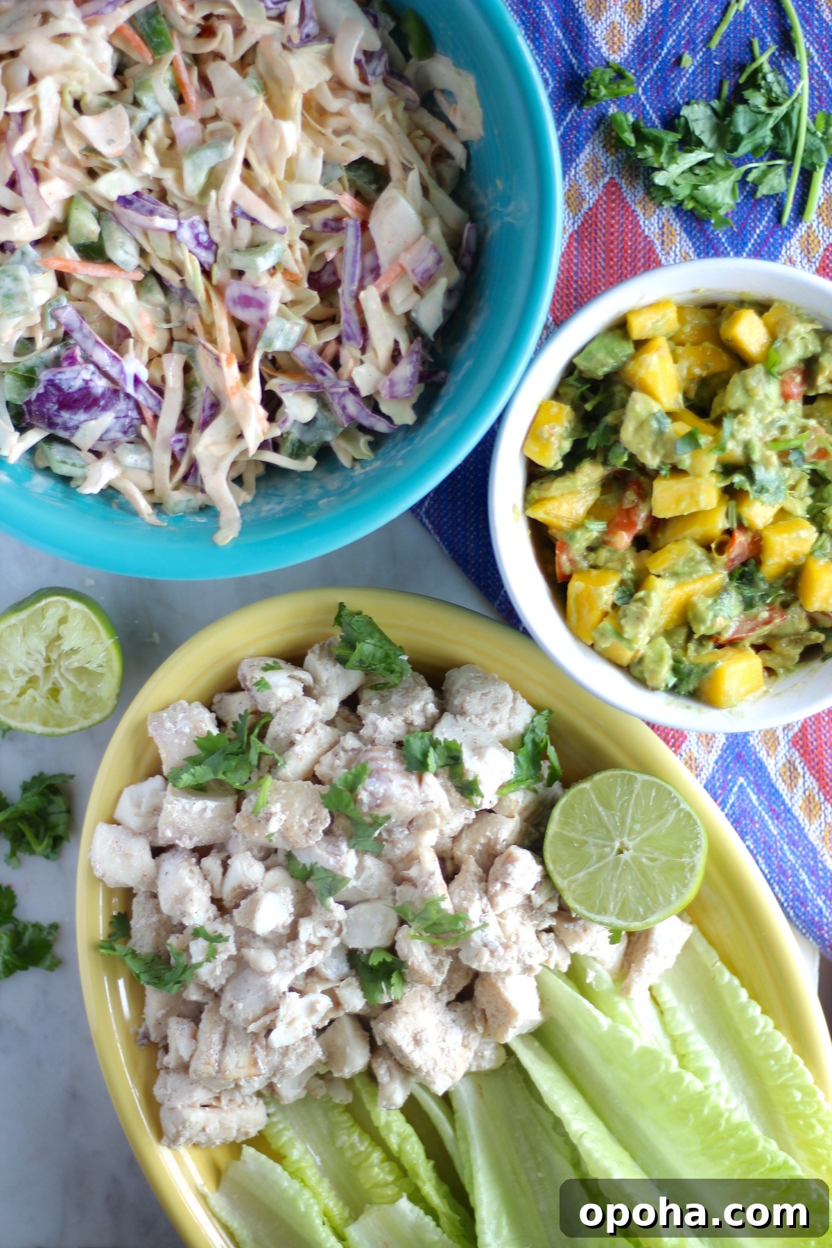 Maui Fish Tacos - light marinated white fish is topped with juicy mango guacamole and spicy coconut milk slaw! | fedandfulfilled.com