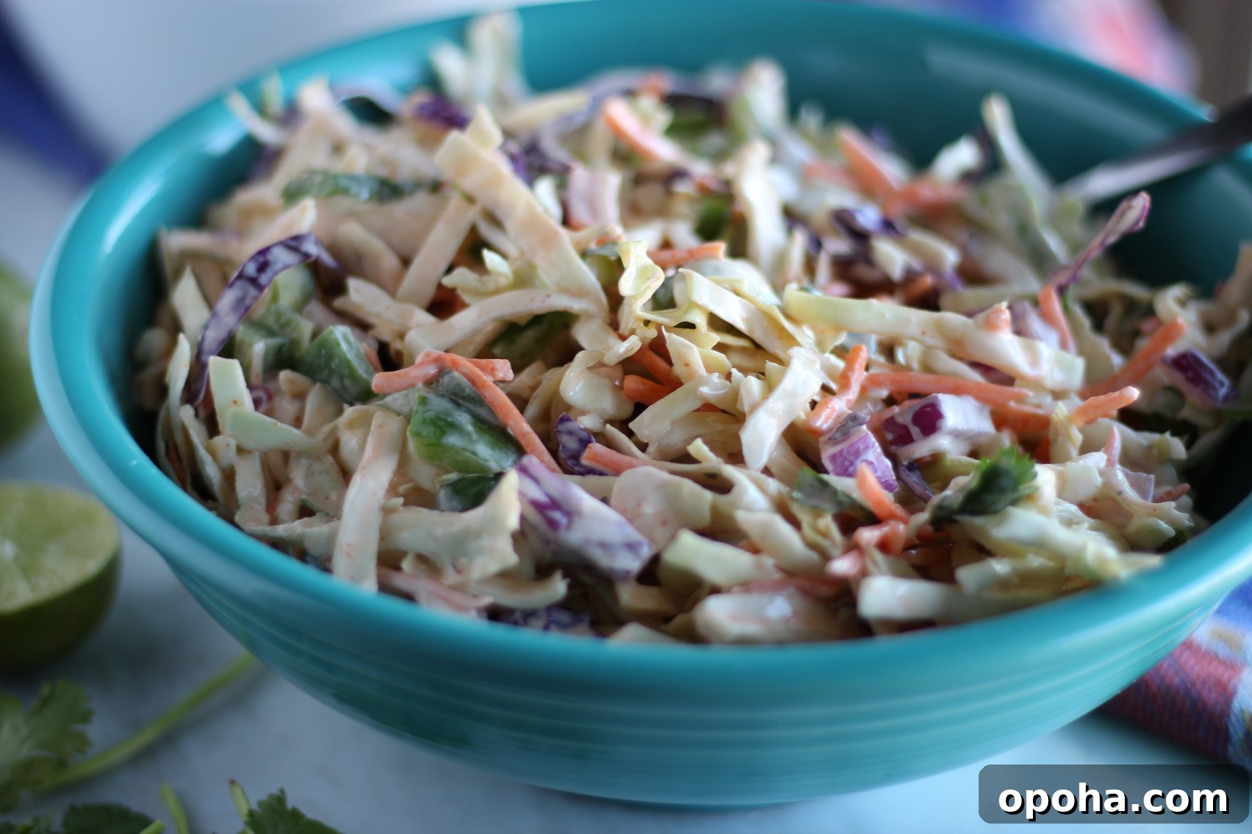 Maui Fish Tacos - a spicy coconut milk cabbage slaw and mango guacamole are piled on top of soft white fish to make delicious lettuce wrap tacos! | fedandfulfilled.com