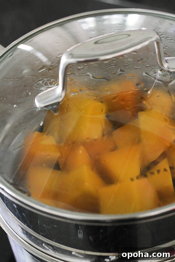 Crispy Pumpkin Fritters with Maple Cinnamon Glaze 5 pumpkin pieces in a steamer basket.