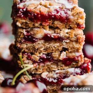 Chewy Cherry Pie Bars with Buttery Crust Recipe 12 A stack of cherry pie bars.