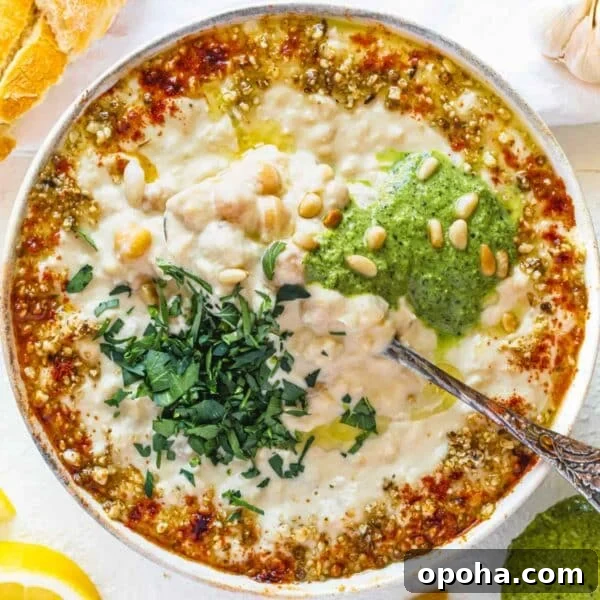Creamy Whipped Ricotta Recipe: Quick Tips and Serving Ideas 6 Masabaha with a silver spoon and fresh parsley