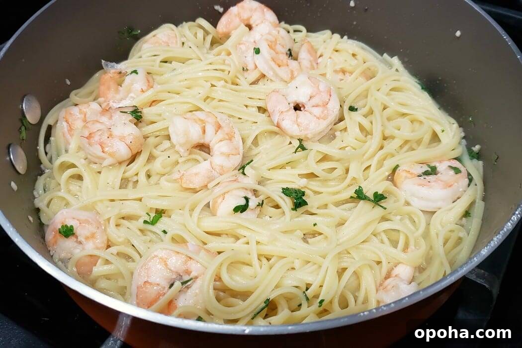 linguine added to the pan with the shrimp scampi.