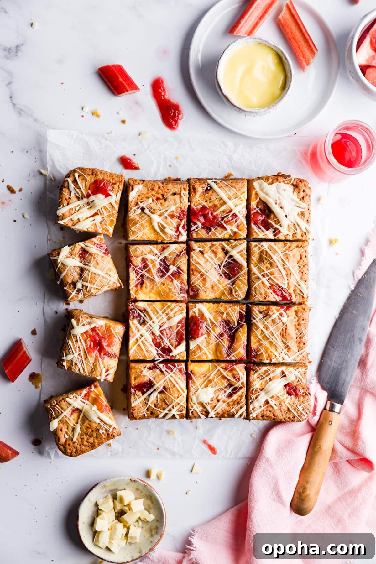 Rhubarb and Custard Blondies Recipe 3 overhead close up at rhubarb and custard blondies cut into 16 squares