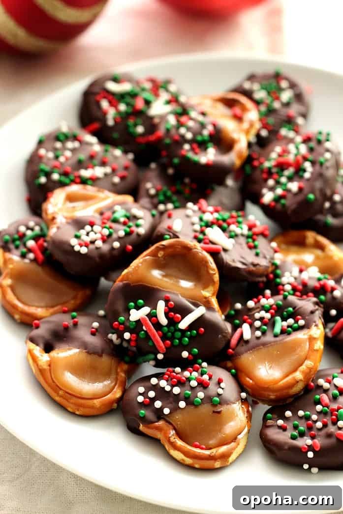 How to make caramel pretzel bites. Pretzel bites dipped in chocolate on a plate.
