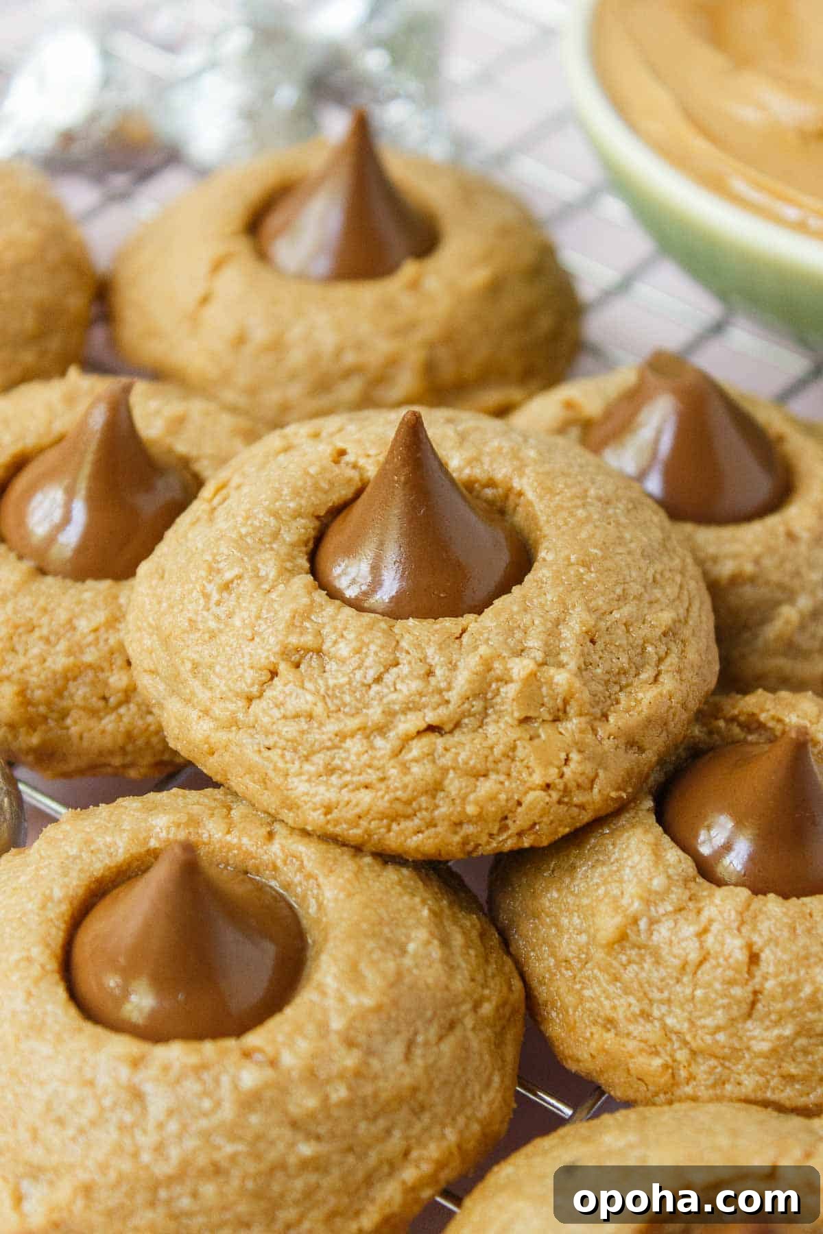 3-Ingredient Peanut Butter Blossom Cookies — Quick Holiday Treat 2 Peanut butter blossoms are peanut butter cookies with a Hershey Kiss pressed into the center.