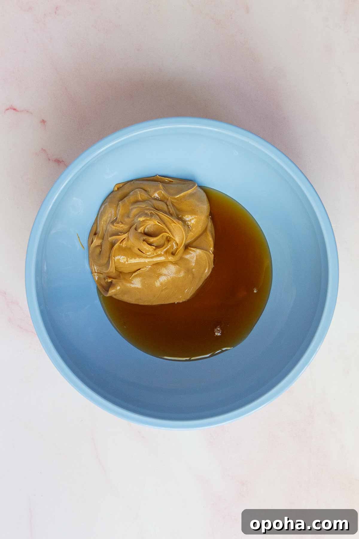 3-Ingredient Peanut Butter Blossom Cookies — Quick Holiday Treat 4 Creamy peanut butter and pure maple syrup in a medium mixing bowl.