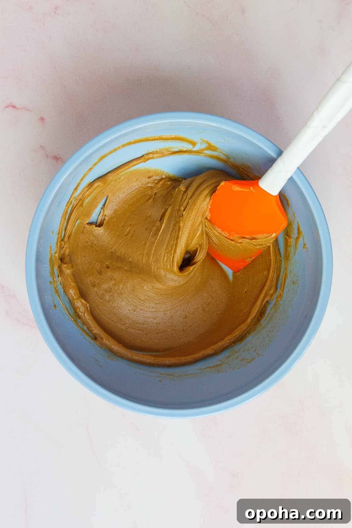 3-Ingredient Peanut Butter Blossom Cookies — Quick Holiday Treat 5 Peanut butter and maple syrup mixed together in a medium mixing bowl