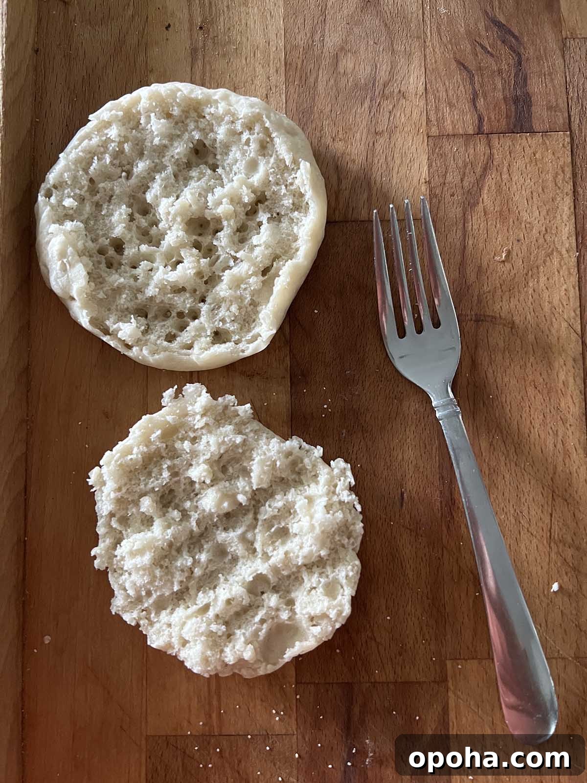 Crispy Air Fryer English Muffins Recipe 3 English muffin and a fork.