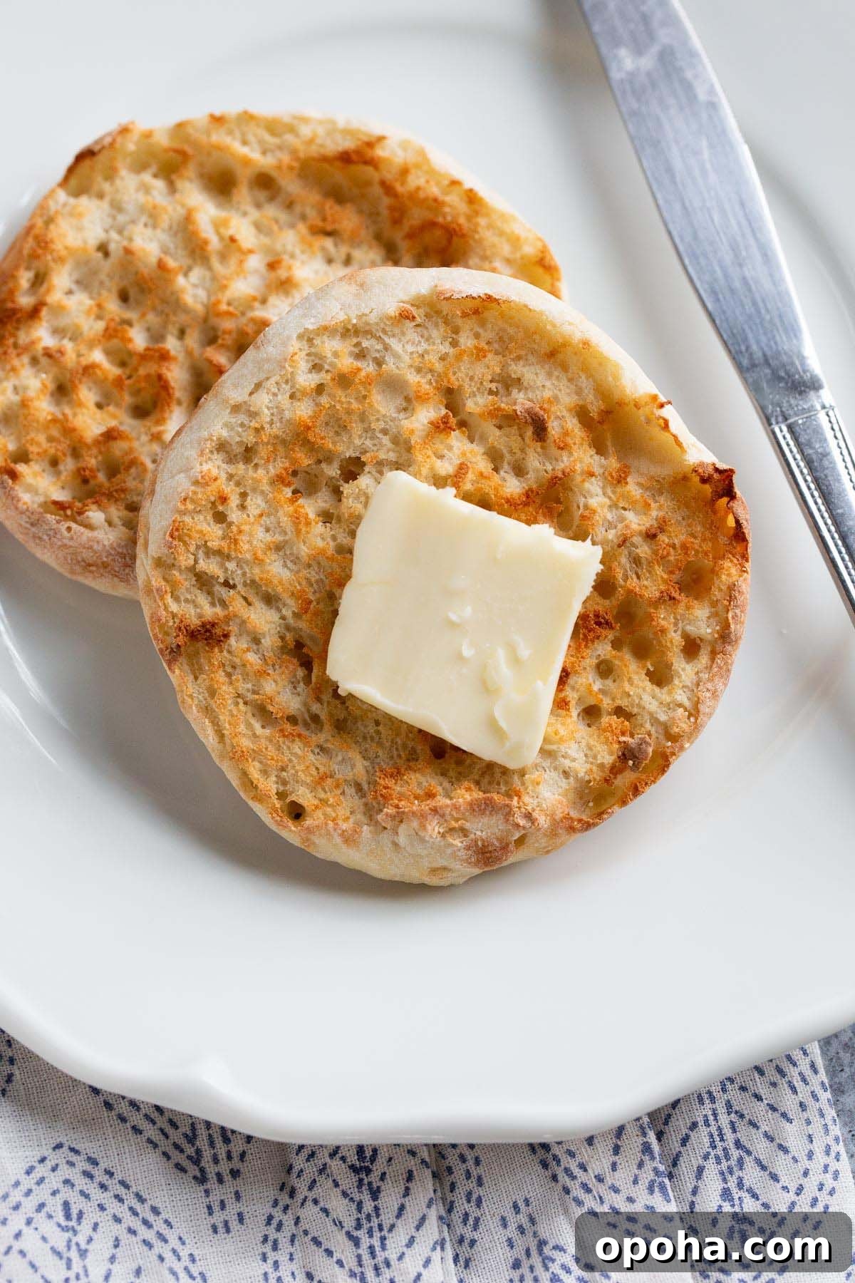 Crispy Air Fryer English Muffins Recipe 6 Toasted English muffin with butter.
