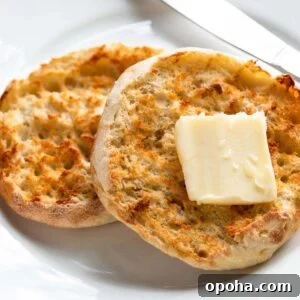 Crispy Air Fryer English Muffins Recipe 7 Toasted English muffin topped with butter.