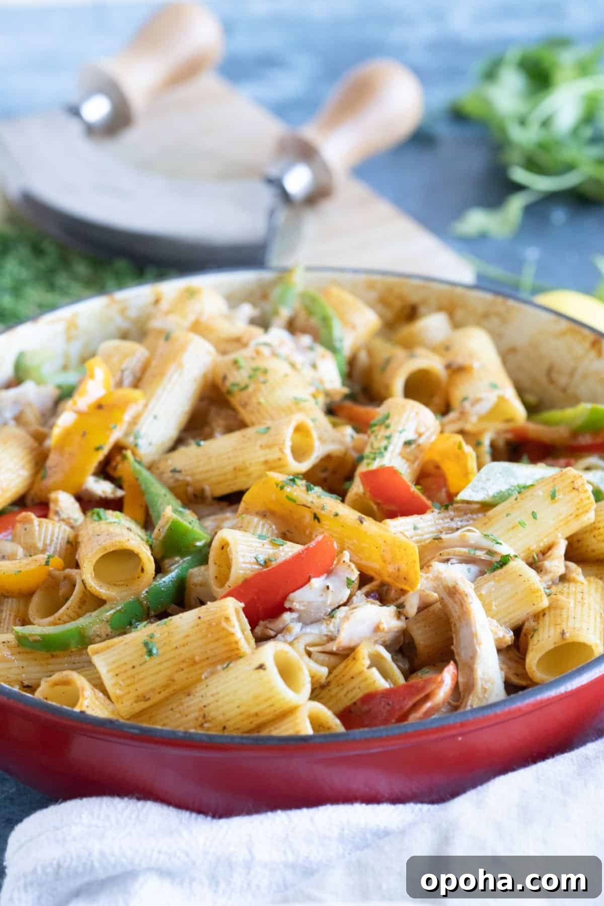 Creamy Rasta Pasta with Leftover Chicken — Quick Caribbean-Inspired Meal 2 A pan of rasta pasta with sauteed bell peppers and chicken.