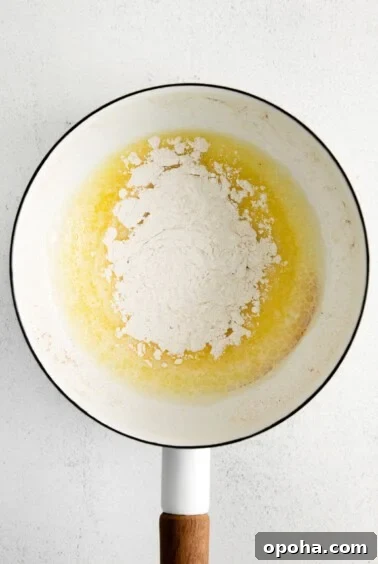 Creamy Cheddar Cheese Sauce Recipe for Smooth, Velvety Texture 5 flour and butter in pot.