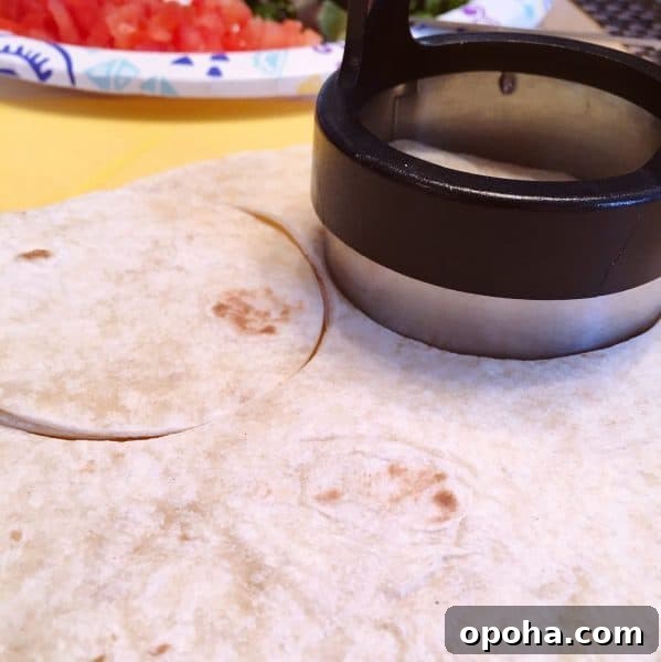 using a Biscuit cutter to cut out flour tortilla shells