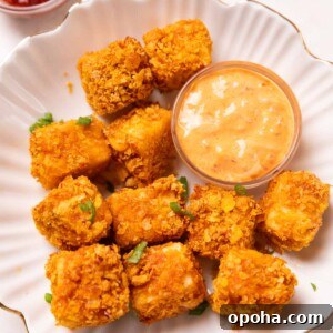 120+ Delicious Vegetarian Diwali Recipes to Try This Year 3 air fryer paneer popcorn served on a white plate with accompaniments