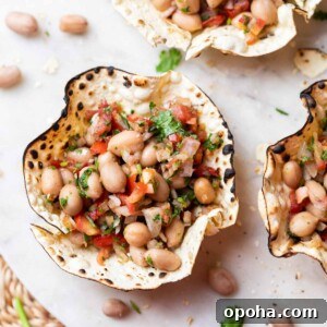 120+ Delicious Vegetarian Diwali Recipes to Try This Year 4 edible papad bowls filled with peanut chaat and served on a white platter