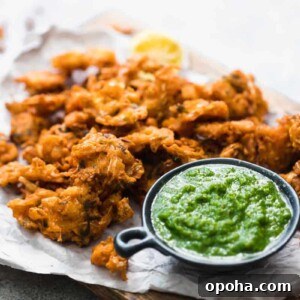 120+ Delicious Vegetarian Diwali Recipes to Try This Year 32 vegetable pakoras served on a wooden board