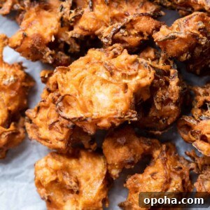 120+ Delicious Vegetarian Diwali Recipes to Try This Year 41 onion pakodas served on a board