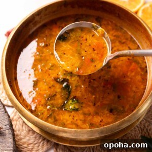 120+ Delicious Vegetarian Diwali Recipes to Try This Year 49 orange rasam in a container