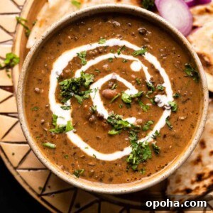 120+ Delicious Vegetarian Diwali Recipes to Try This Year 55 Dal Makhani served in a brown ceramic bowl