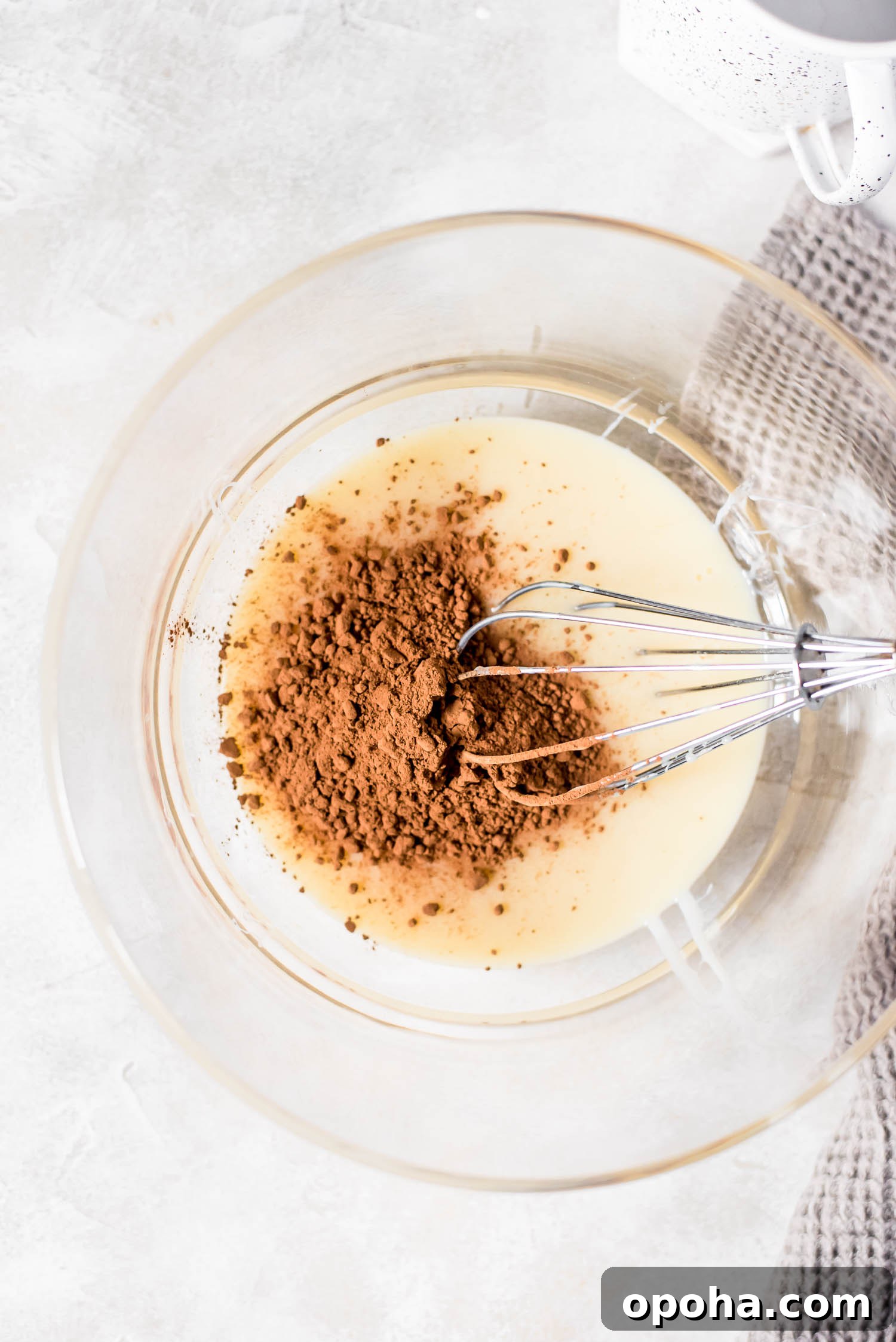 Rich Mocha Coffee Creamer Recipe for Smooth, Chocolatey Mornings 2 coffee creamer preparation adding cocoa powder to sweetened condensed milk