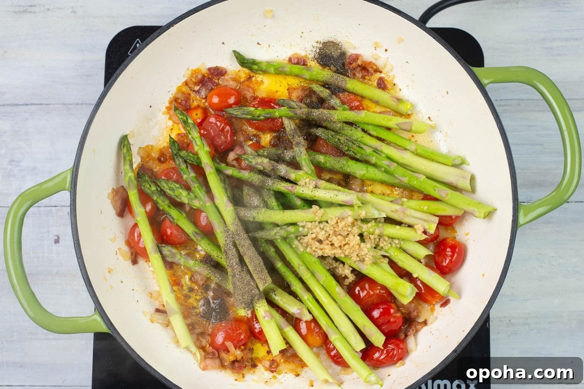 Sautéed Asparagus, Tomatoes & Bacon Skillet Recipe 7 Sautéed Asparagus ingredients in an enamel skillet.